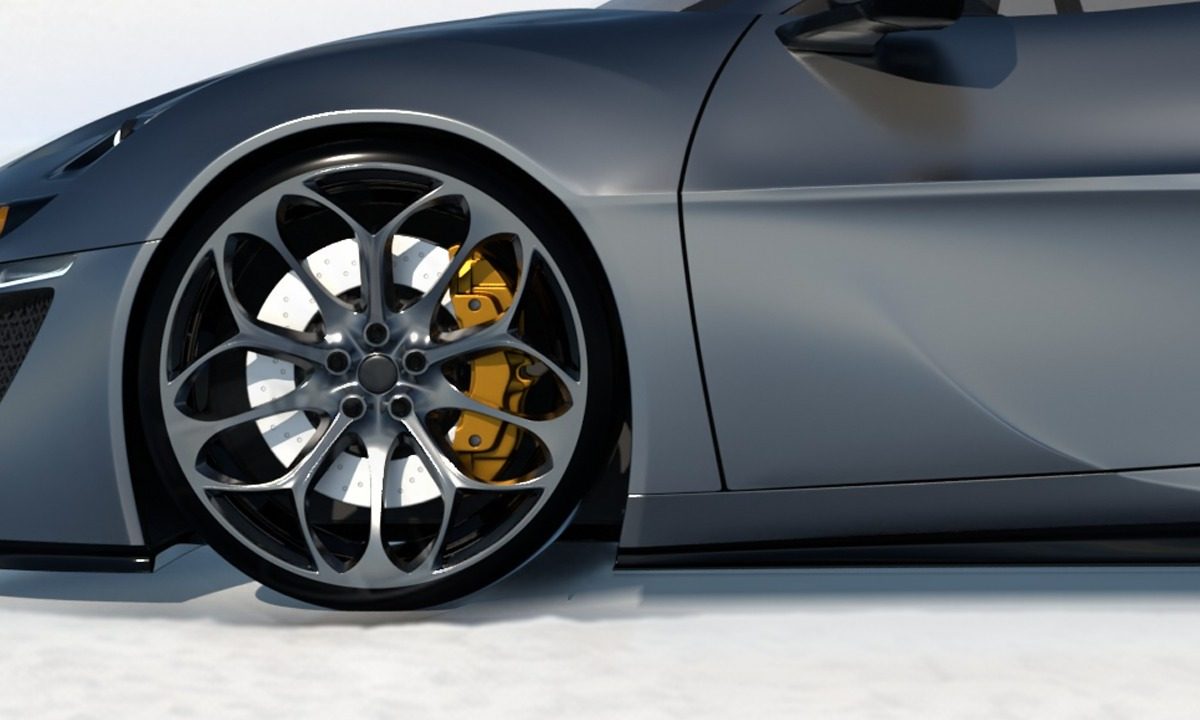 Multi-spoke wheel, perforated disc, yellow caliper.