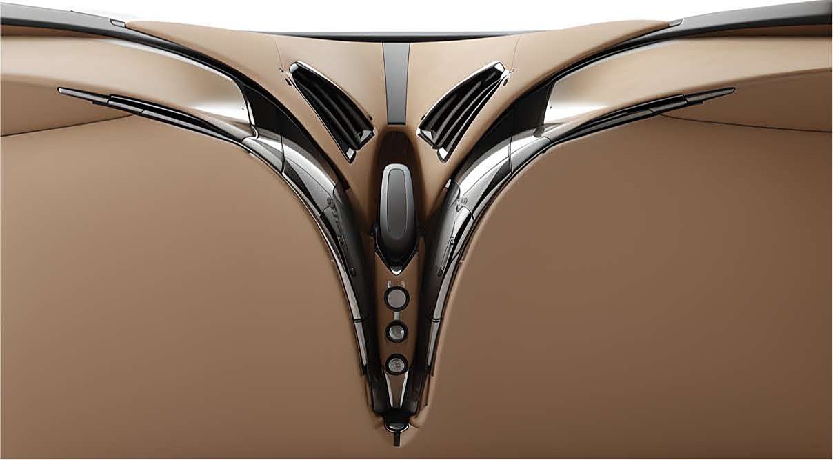 V-console in polished metal against tan leather.